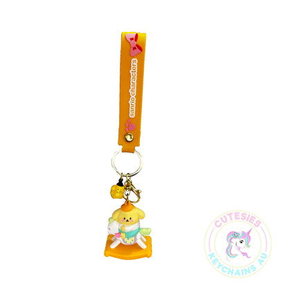 Cute Baby pompom dog on rocking horse keychain, pastel keychain, cute Kawaii keychain